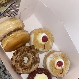 Cheesecake , maple bacon , red velvet cream cheese , regular donuts