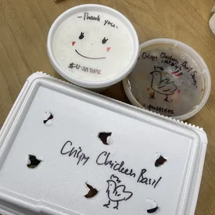 a happy cake and a cup of yogurt