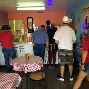a group of people standing in line