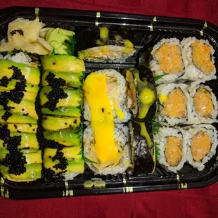 Spicy salmon maki, maki with mango sauce, and one with avocado