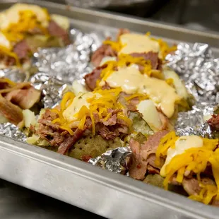 Loaded Reuben Potato - corned beef with melted cheese and house-made Thousand Island dressing.