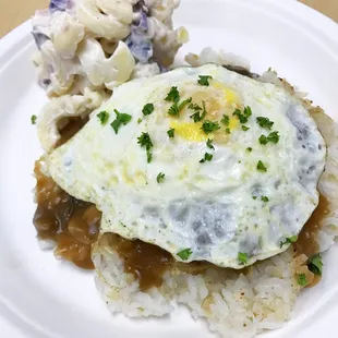 Turkey Moco w/ uala mac salad. House-made turkey patty and vegetarian demi glace fried egg.