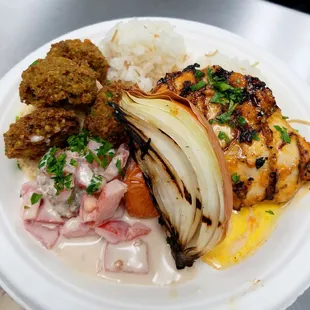 $9 Mixed plate: Seared chicken breast w/ lilikoi gastrique, uala falafel and fire roasted onion and tomato, hummus &amp; pickled vegetables.