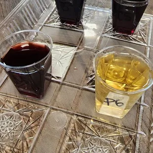 four glasses of wine on a tray