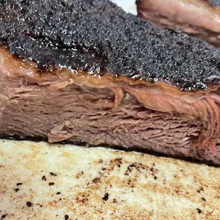 a close up of a bbq sandwich