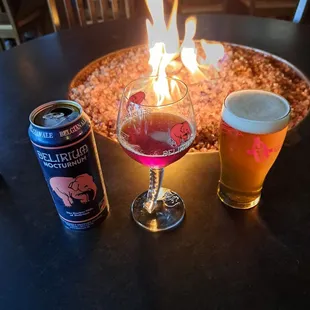 a beer and a pizza on a table