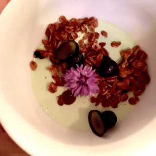 Panna Cota with granola and edible flowers.