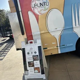 a fork, spoon, and knife on the side of the truck