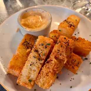 Potato batons with harissa yogurt