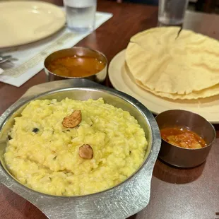 a bowl of rice and a plate of naan bread