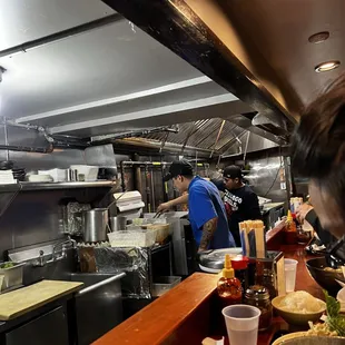 a man preparing food in a restaurant kitchen