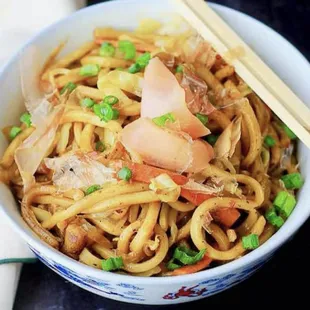 a bowl of udon sushi