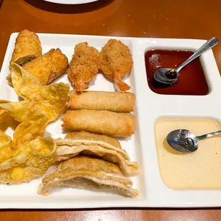 UDON SAMPLER A combination of 2 spring rolls, 2 crab Rangoon, 2 pot stickers, 2 butterfly shrimp, 1 chicken egg roll.