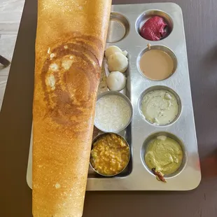 a pancake with various condiments