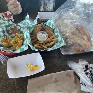 a hot dog, fries, and a sandwich