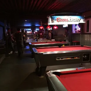 Beer pong and pool tables on the same floor