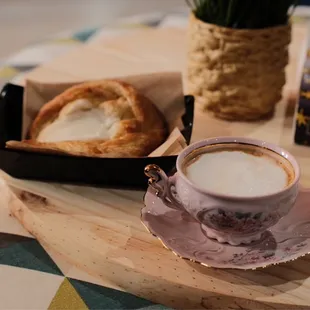 a cup of coffee and a pastry