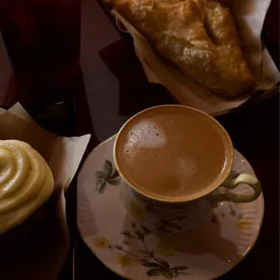 a cup of coffee and a pastry