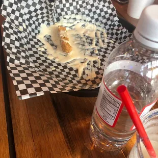 a half eaten donut and a drink