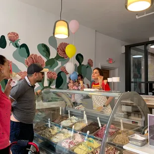 a group of people standing in front of a counter