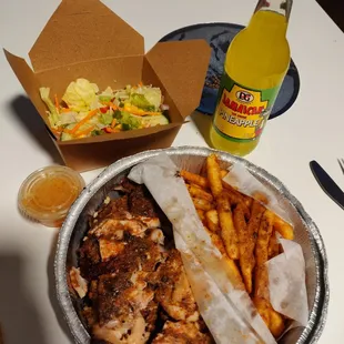 Jerk Chicken Platter w/ Fries and Salad. Hot Jamaica Sauce on the chicken and fries