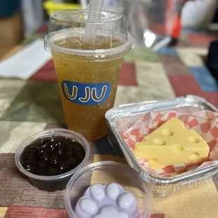 Honey chia green tea 75% sweet with boba, ube paw pudding, and cheese flan.