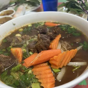 Bo Kho- spicy beef stew with rice noodles , thumbs up from my crew