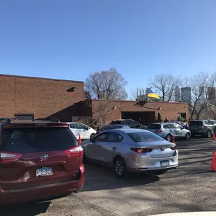 Cars lined up for the Lenten Friday Fish Fry. Line goes pretty fast for the to-go, drive up only fish today. And the fish is good!