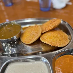 three different sauces on a tray
