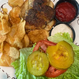 Blackened grouper sandwich comes with chips. Good, but okra was my favorite. I would probably choose something else.