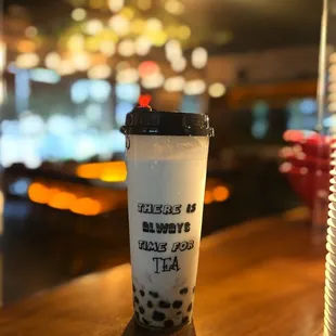 a cup of bubble tea on a table