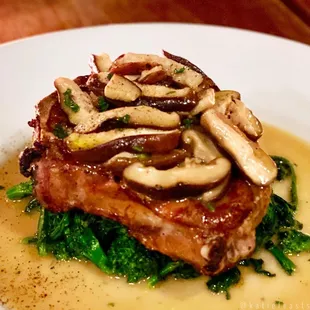 Dry-aged pork chop with shitaki mushrooms