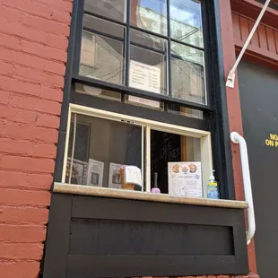 a brick building with a window