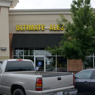 a truck parked in front of a store