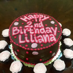 a birthday cake with cupcakes