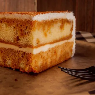 a slice of cheesecake on a plate with a fork