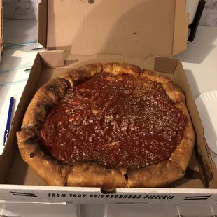 a deep dish pizza in a box