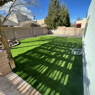 a backyard with artificial grass