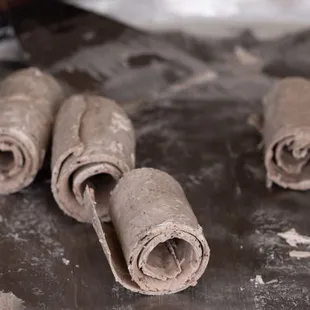 rolled up dough on a table