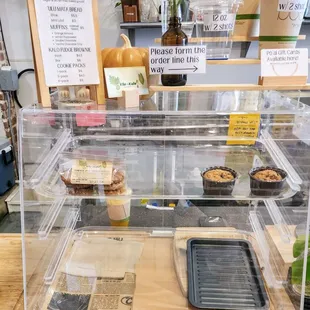This is the extent of this &quot;bakery.&quot; 2 &quot;muffins&quot; and a 6 pack of cookies in a display case at a coffee shop. September 2024.