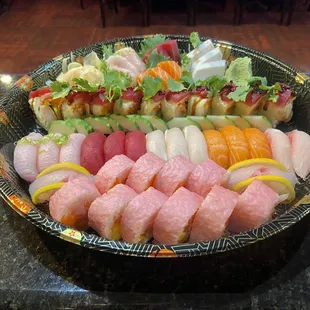 LOVE BOAT:16 assorted sushi.12pc assorted sashimi.one New Yorker roll and one Amazing roll.