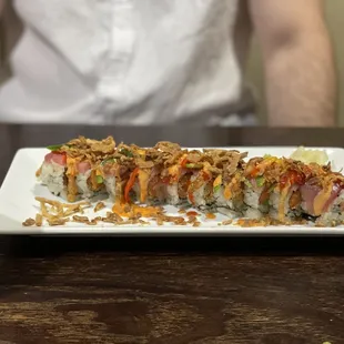 a plate of sushi and a cup of tea
