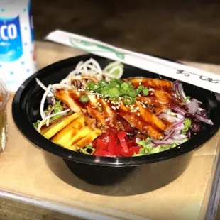 a bowl of food and a drink