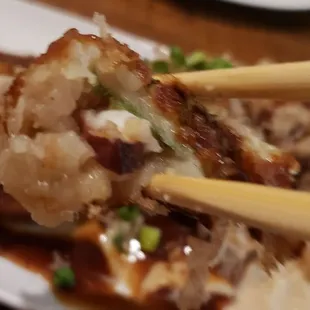 chopsticks and a plate of food