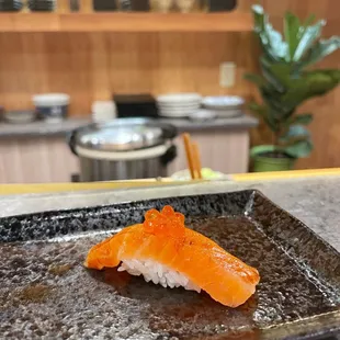 a sushi on a plate