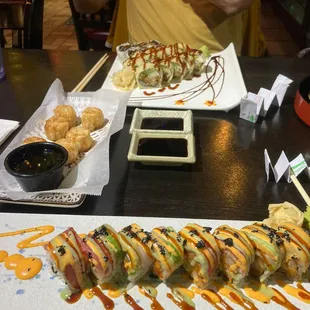 a sushi roll with a side of dipping sauce