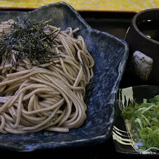 Zaru Soba with sauce, green onions, grated radish and quail egg on the side