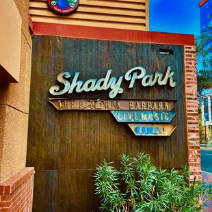 Sign is on. the side of the restaurant