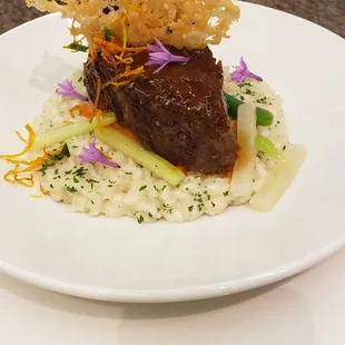 My favorite dish to cook for special occasions Braised short ribs, served over mushroom risotto, topped with parm crisps &amp; society garlic.