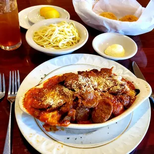 Eggplant Parmesan topped with Italian Sausage